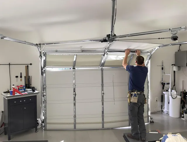 Parma Heights Garage Door Repair specialist performing precise section replacement on Parma Heights garage door