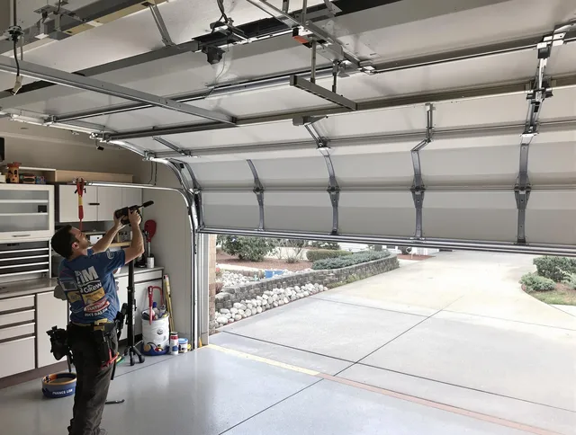 Garage door track repair service by Parma Heights Garage Door Repair in Parma Heights